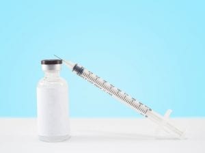Blank label medical glass vial and plastic syringe for injection